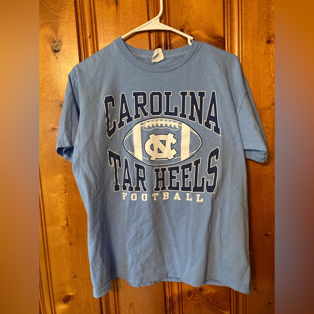 Says size X-Large but fits like a Medium Women’s Carolina Tar Heels Football top